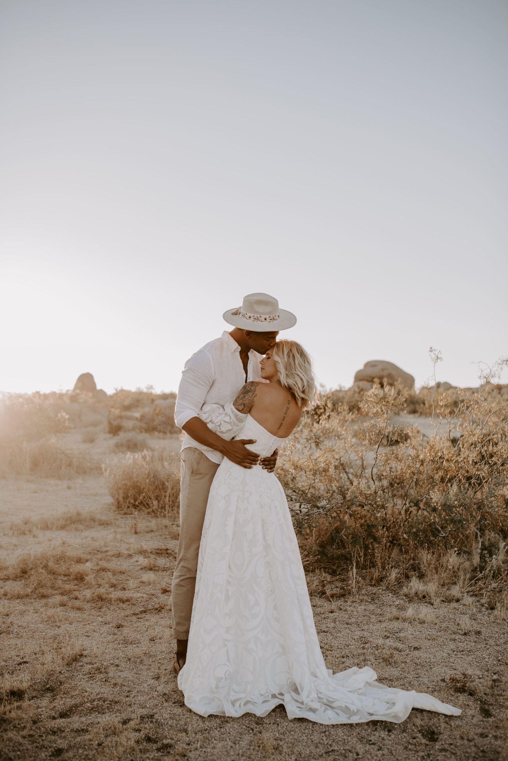 Bride and groom sharing a hug at Joshua Tree National Park for their elopement shoot with Off Path Photography