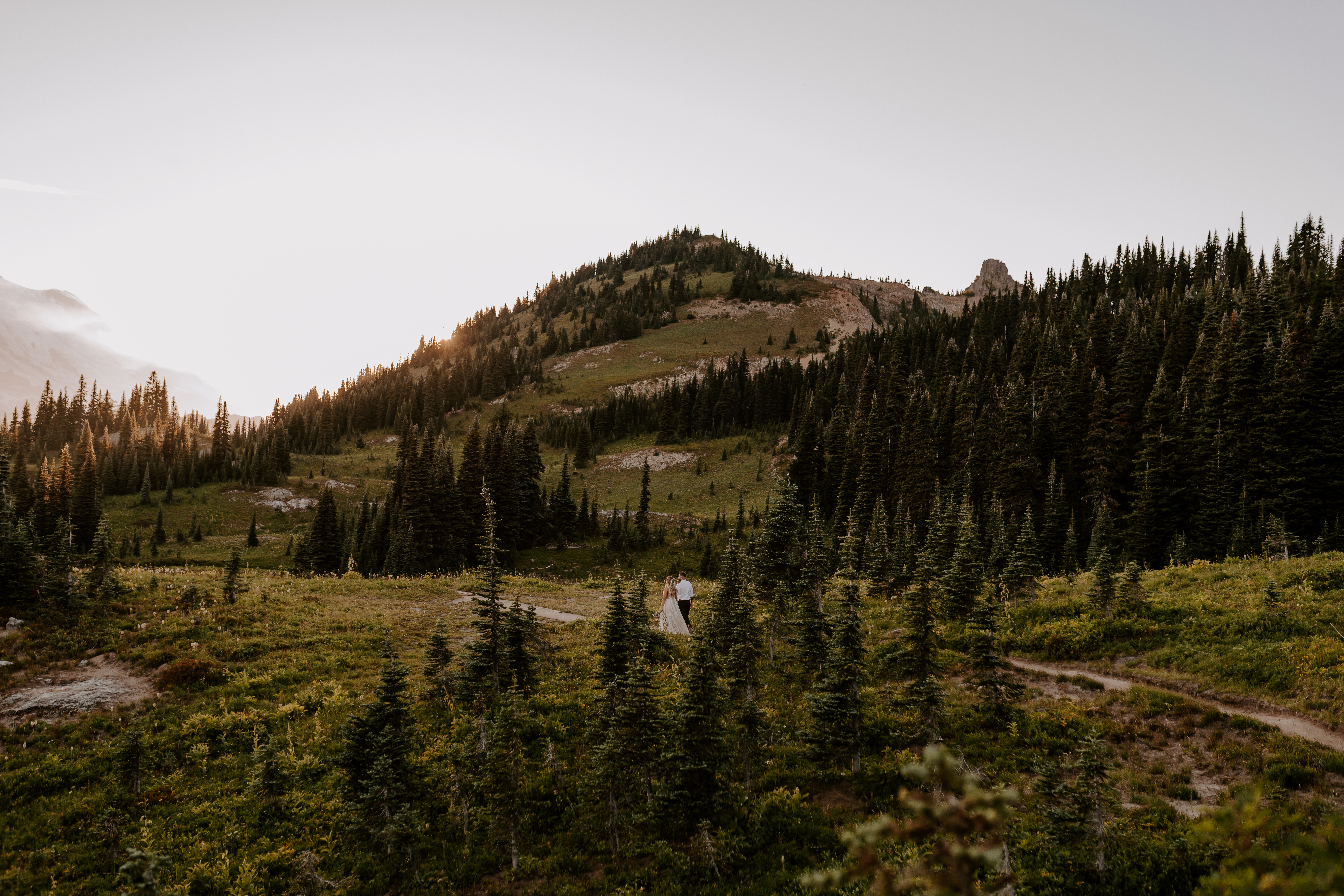 Couple walking along a path during their Washington State elopement with Off Path Photography