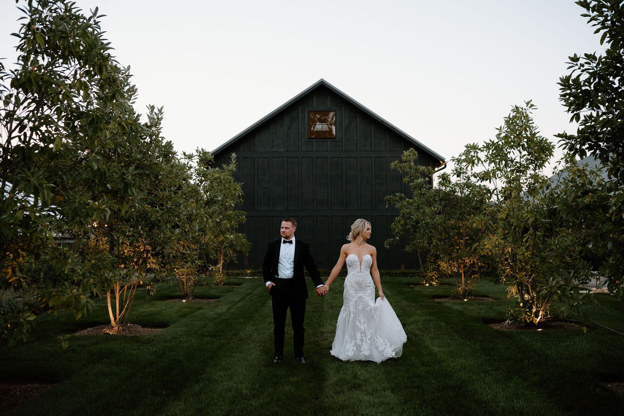 bride and groom standing at their Elegant Greenhouse Wedding